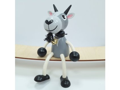 goat with bell wooden figure on spring