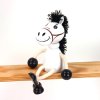 wooden sitting figure white horse