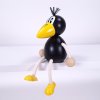 raven hand painted wooden figure with spring