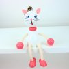 white kitty bouncing wooden figure