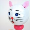 handmade wooden figure with spring white cat