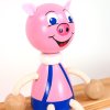 piggy wooden sitting figure