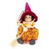 red witch wooden figure on spring
