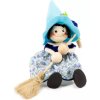 blue witch wooden figure on spring