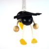 raven wooden handpainted figure on spring