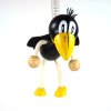 raven handmade wooden figure on spring