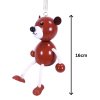brown bear wooden figurine on spring