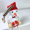 snowman with gift wooden doll on spring