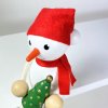 snowman with christmas tree wooden decoration on spring