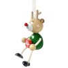 Reindeer with gift christmas wooden figure on spring