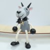 goat with bell wooden figure on spring
