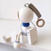 astronaut wooden figure with spring